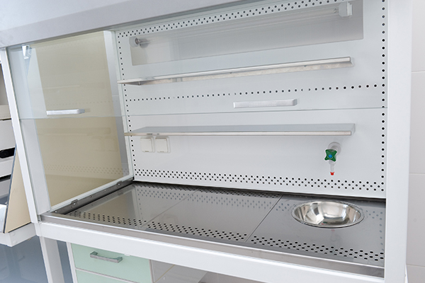 This image depicts a chemical fume hood that looks similar to older fume hoods that often contained asbestos as a fireproofing material.