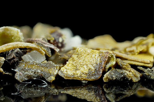 A close-up image of loose tea leaves similar to those that may be found in herbal blends like Essiac tea