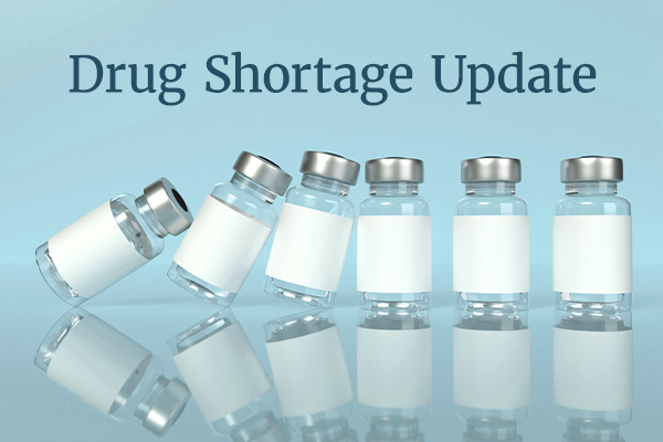 Six small empty vials are lined up. The left-most are tipping into the others, like dominoes. Text reads "Drug Shortage Update."