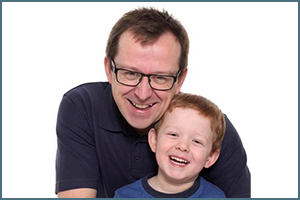 Photo of Paul Cowley, a pleural mesothelioma survivor, along with his son.